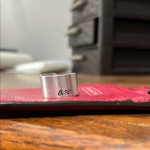 Adjustable aluminum ring with stamped a & heart